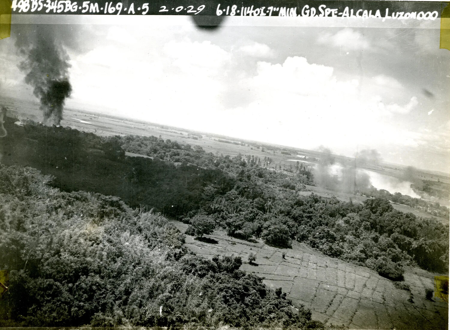 Strike Photo: 498th Bomb Squadron, 345th Bomb Group, Ground Support Mission near Alcala, Luzon