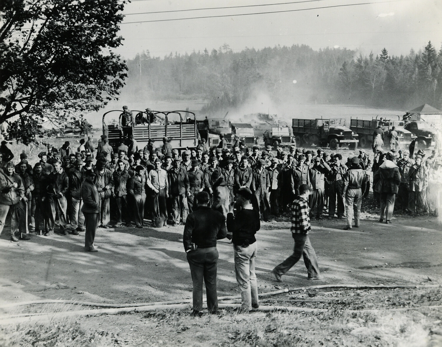 Military Personnel Assembly with Truck Convoy and Press Interview, Field Exercise