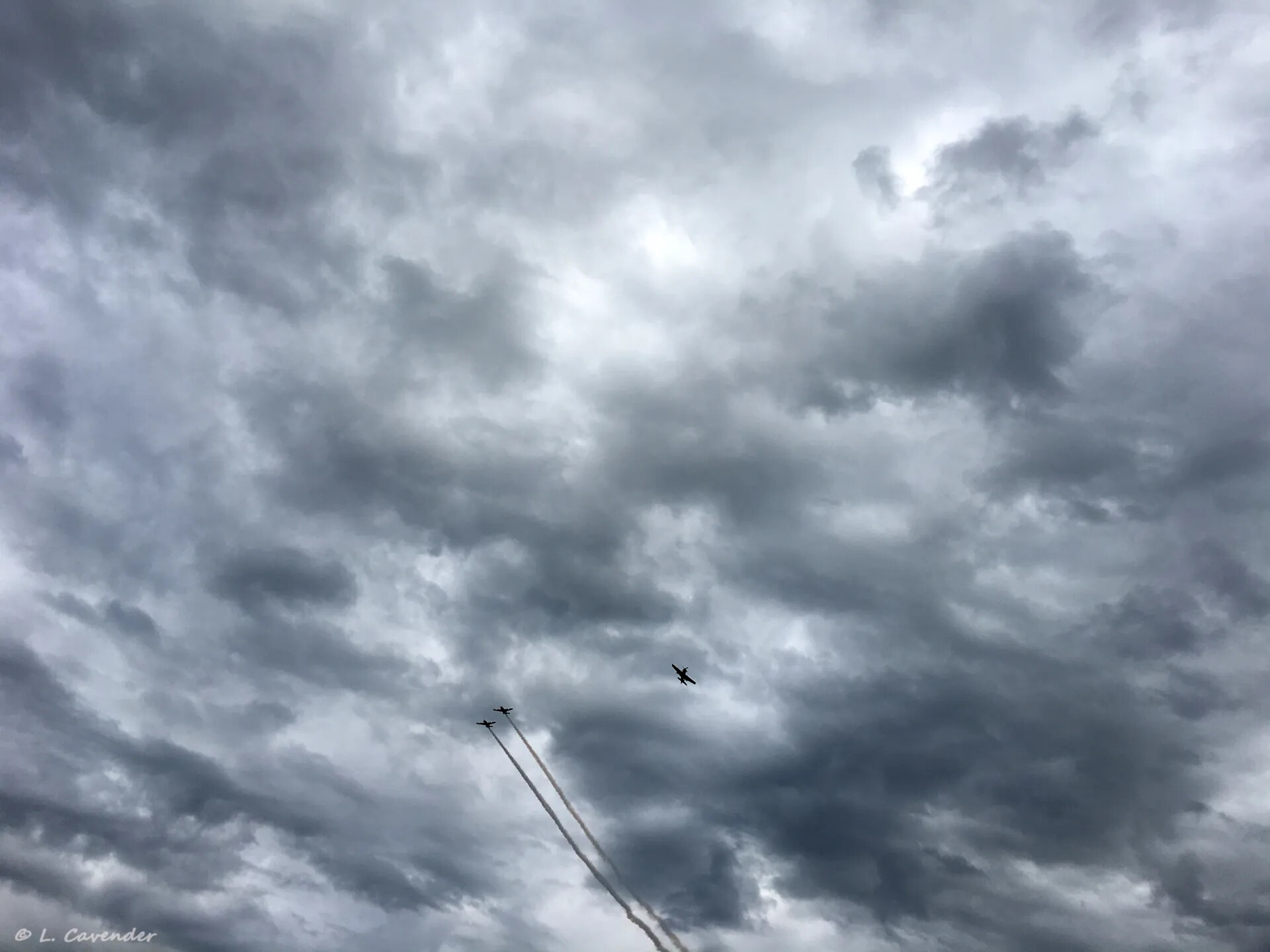 Formation Flyover with Smoke Trails Under Storm Clouds, Mel Swanson Day Event