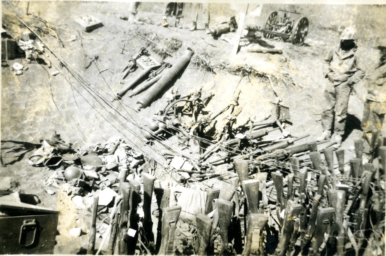 Captured Japanese Weapons Cache with Marine Guard - Iwo Jima, 1945