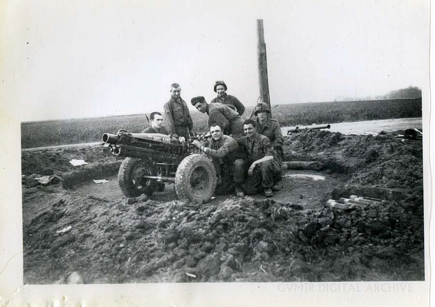75mm Pack Howitzer M1A1 Gun Crew in a Muddy Firing Position, Battle of the Bulge, Winter 1944-45