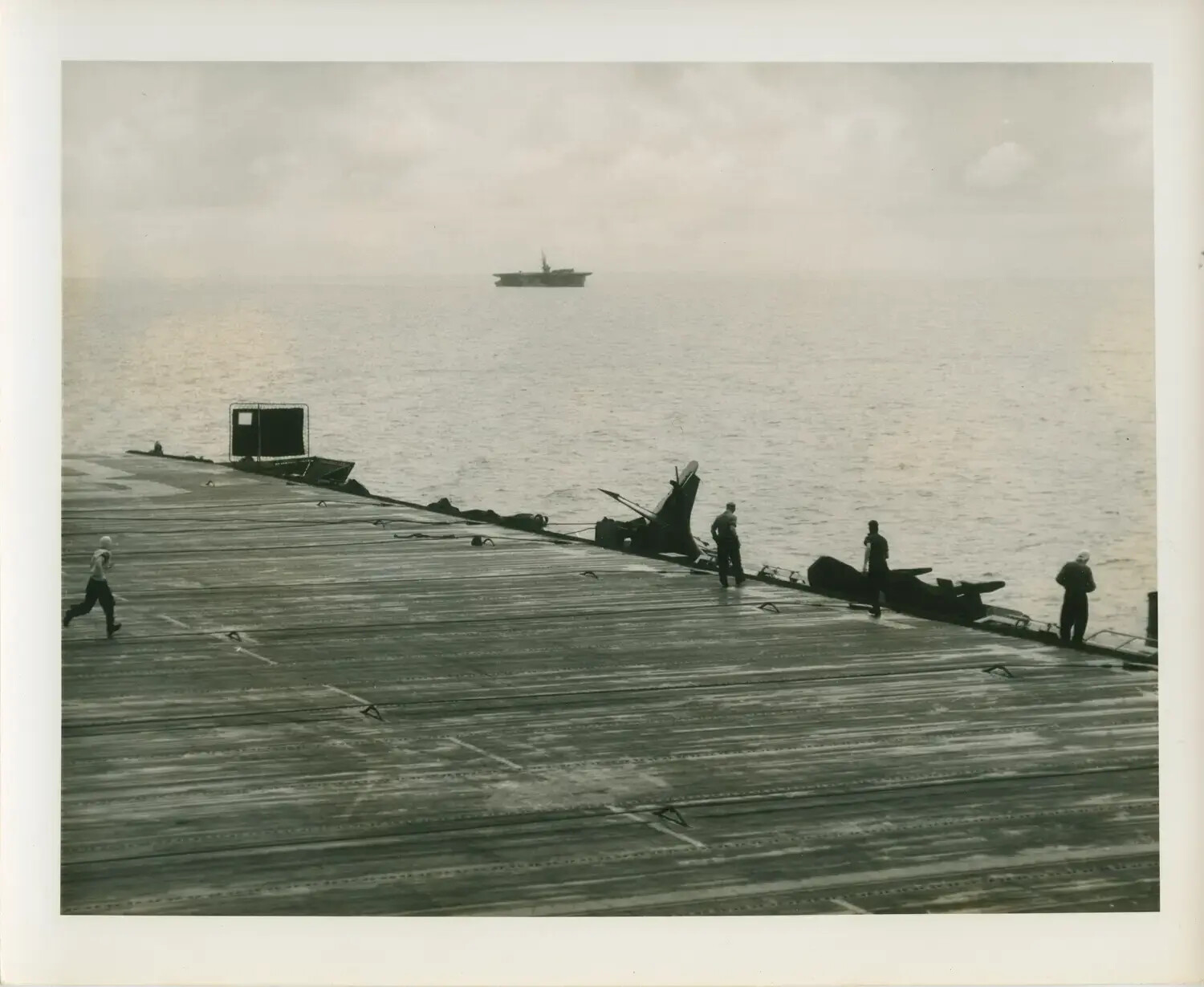 Flight Deck Crew Clearing Aircraft Wreckage Aboard USS Petrof Bay (CVE-80), WWII