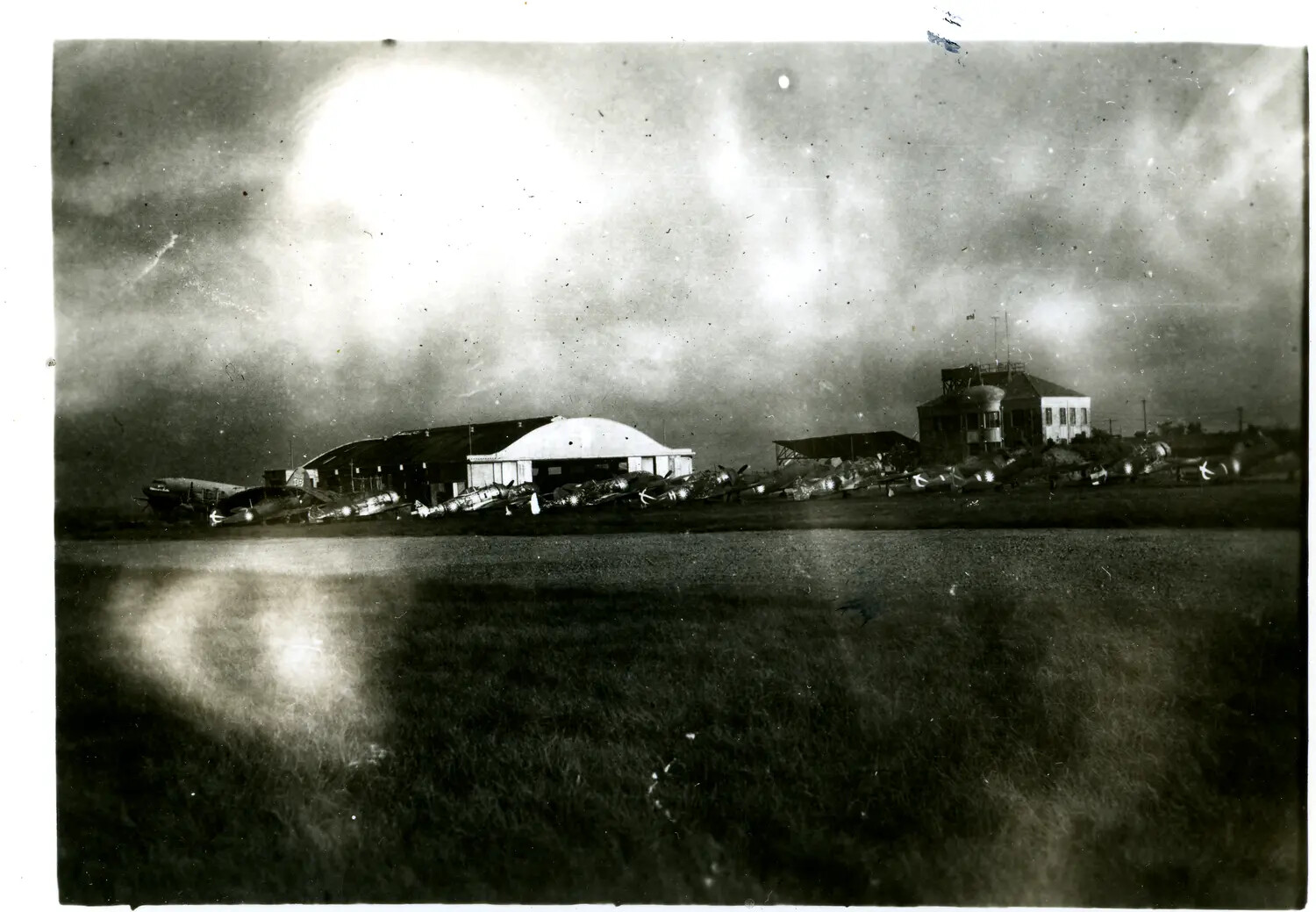 Airfield with Hangar, Control Tower, and Row of Parked Aircraft, Burma Theater, WWII