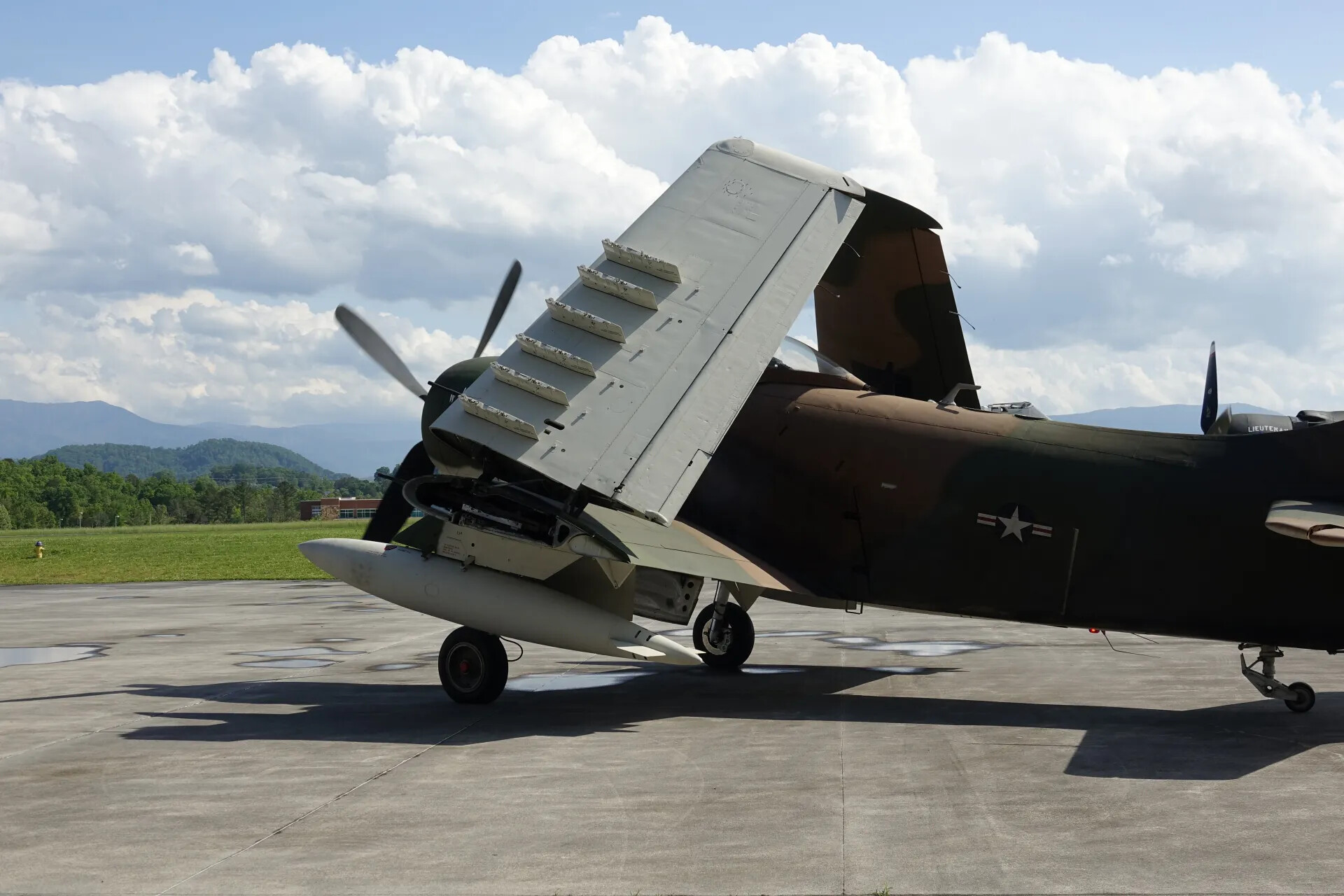 A-1 Skyraider with Wing Folded, Showing Dive Brakes and Underwing Stores, Smoky Mountains Backdrop