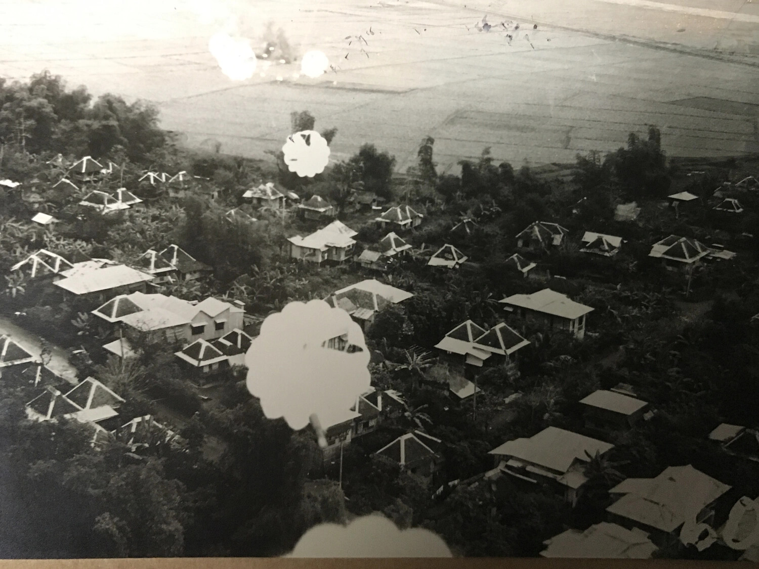 Low-Level Aerial Strike Photograph of Pacific Village with Bomb Detonations, 312th Bomb Group