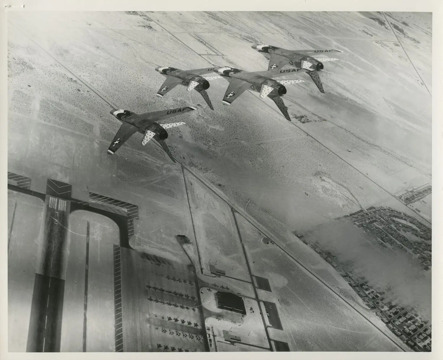 USAF Jet Fighter Formation Over Air Base Runway and Housing Tract
