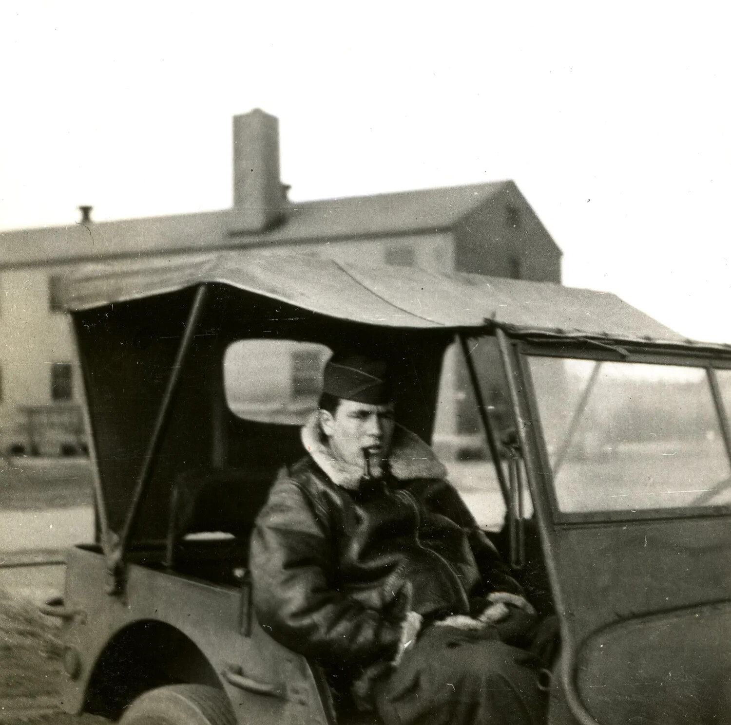 U.S. Army Air Forces Airman in Jeep, Wearing Flight Jacket, WWII Training Base