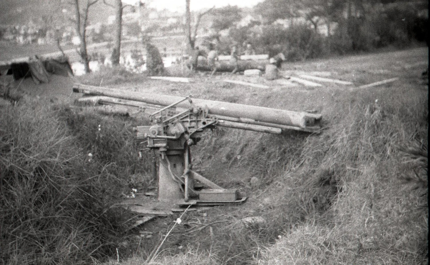 Disabled Japanese Anti-Aircraft/Field Gun in Emplacement Pit, Luzon, Philippines, WWII