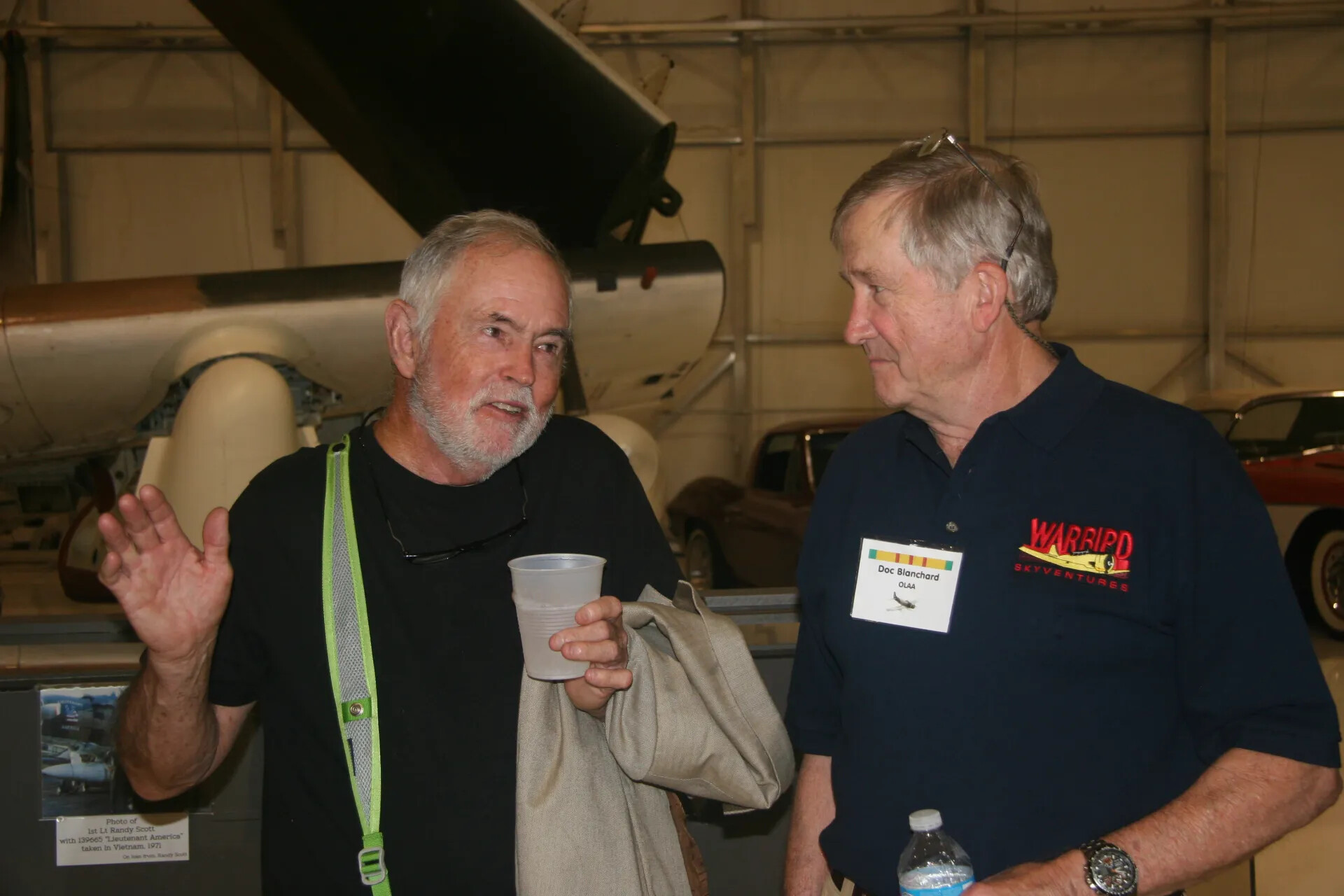 Reunion Attendees 'Doc Blanchard' and Companion in Conversation, Aircraft Restoration Hangar
