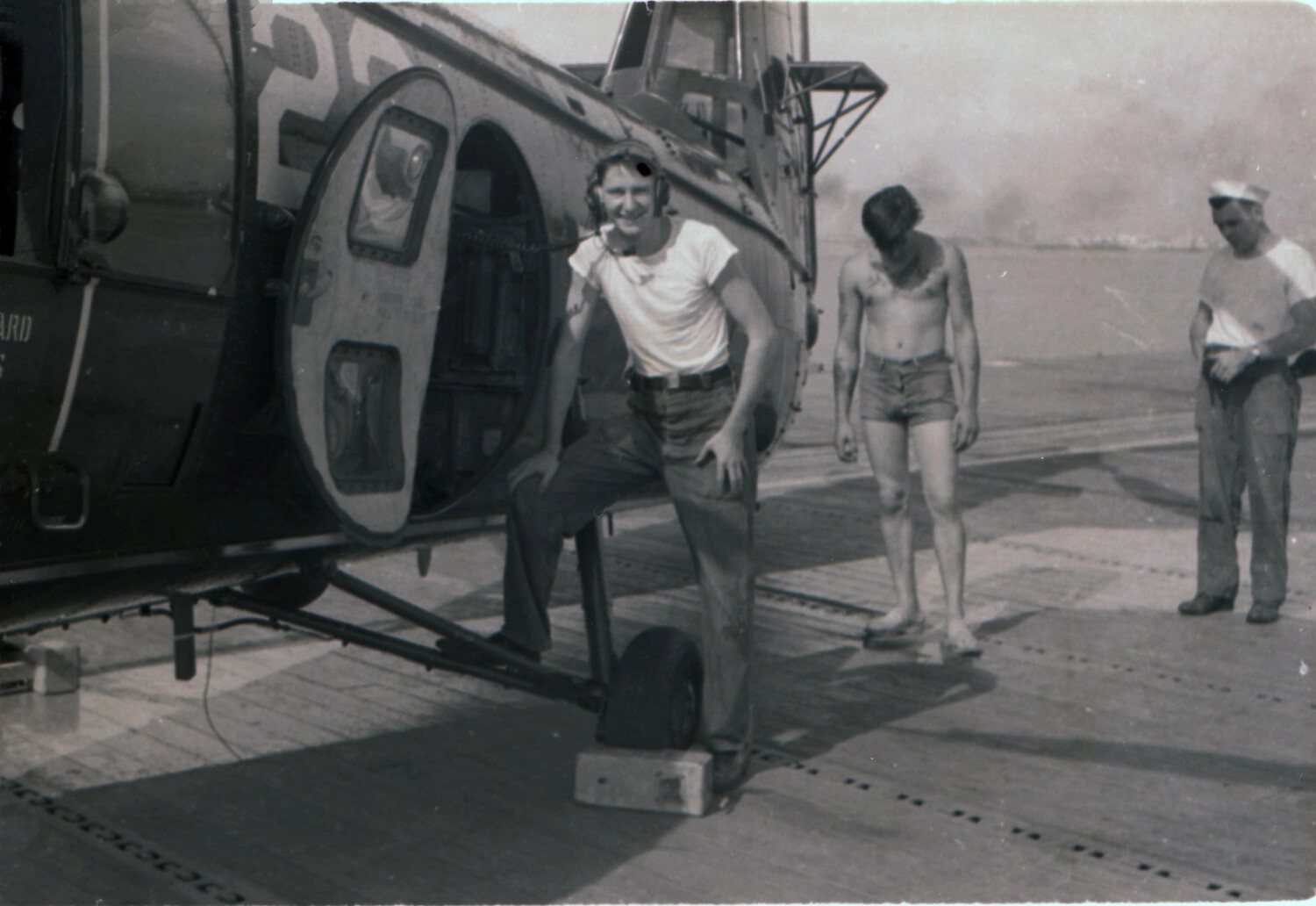 Sailor Posing with HO4S-1 Plane Guard Helicopter Aboard USS Yorktown (CV-10), 1953