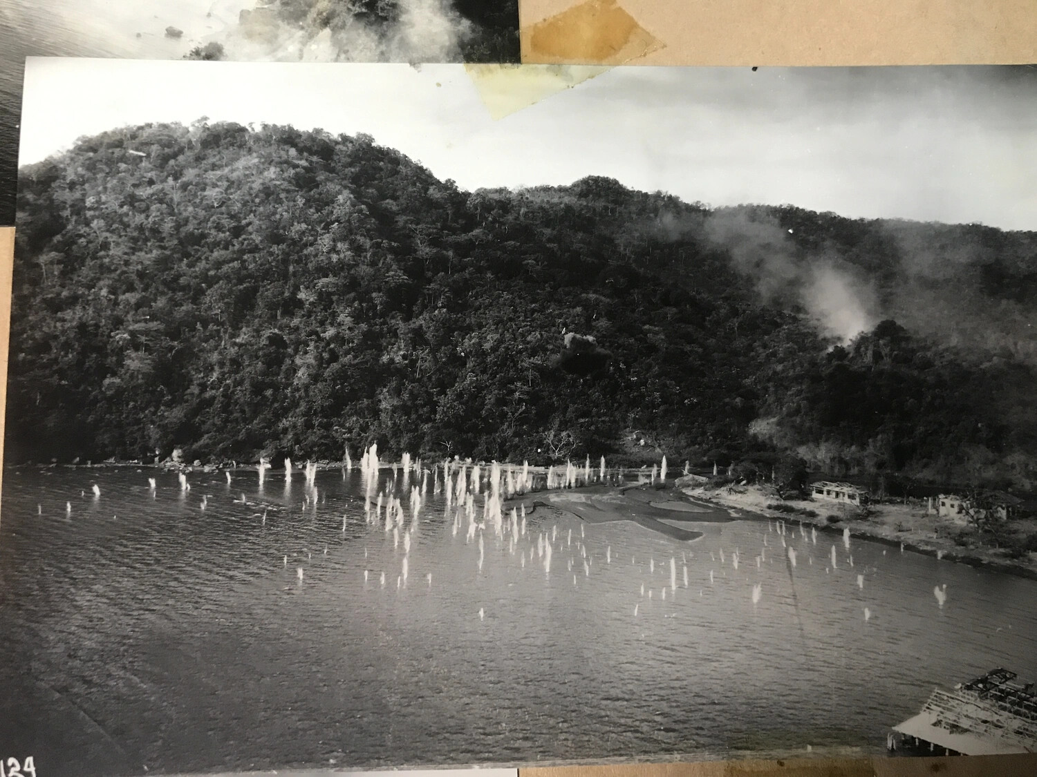 Album Page View of Aerial Strafing Attack Photograph, Coastal Village, Pacific Theater, WWII