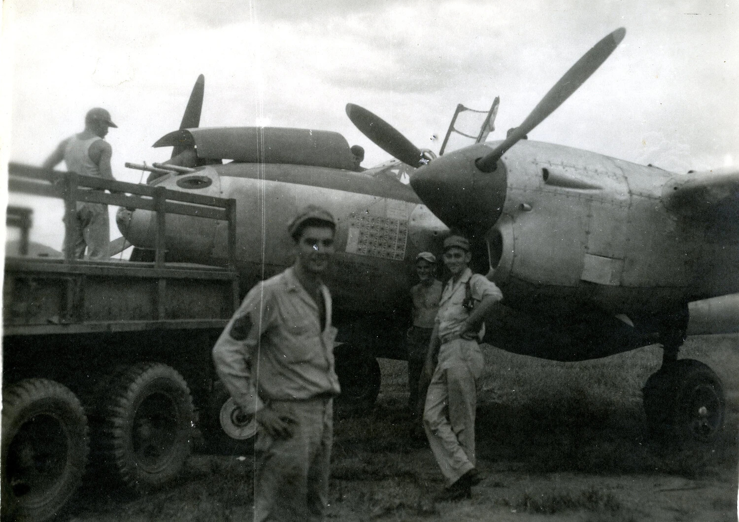 Lockheed P-38 Lightning Fighter Loaded on Cargo Truck with Ground Crew, Pacific Theater, WWII
