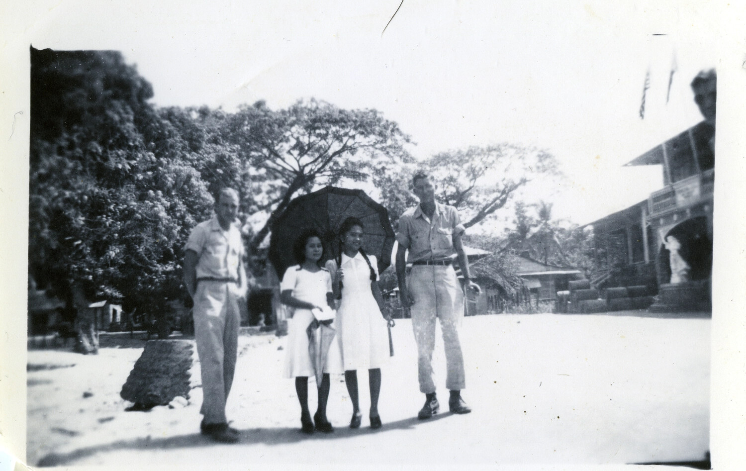 American Servicemen and Local Women on Tropical Street, Philippines (Misfiled Under Okinawa Surrender Folder)