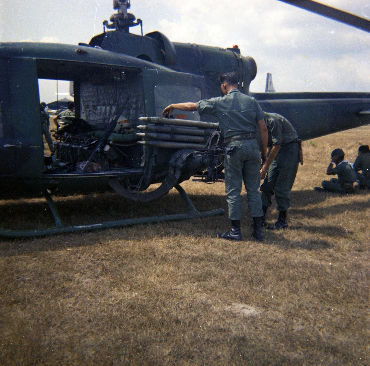 U.S. Army Personnel Arming UH-1B Huey Gunship with 2.75-Inch Rocket Pods, South Vietnam, 1963