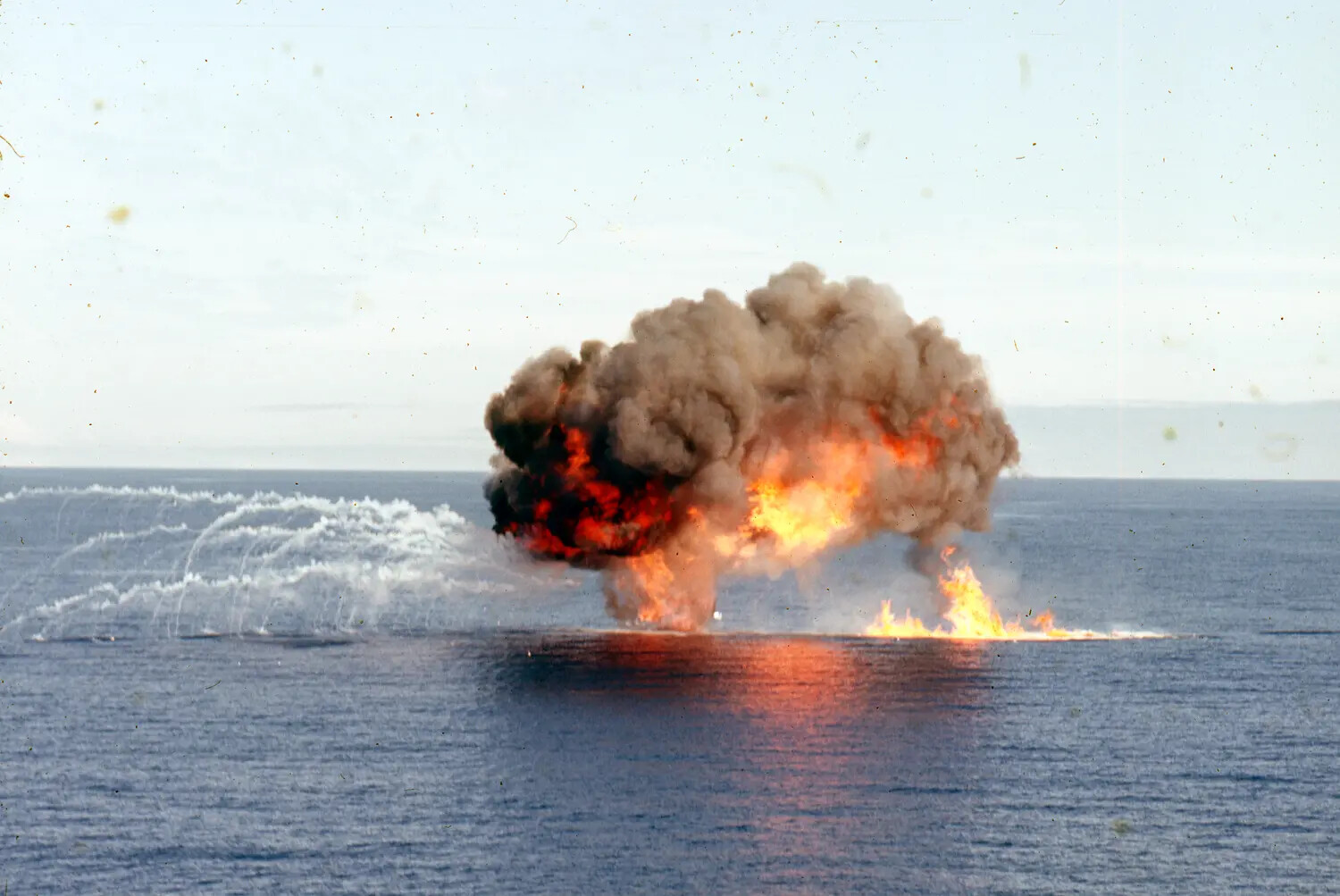 Large Fuel Fire and Smoke Plume on Ocean Surface, Vietnam War Era Fleet Exercise