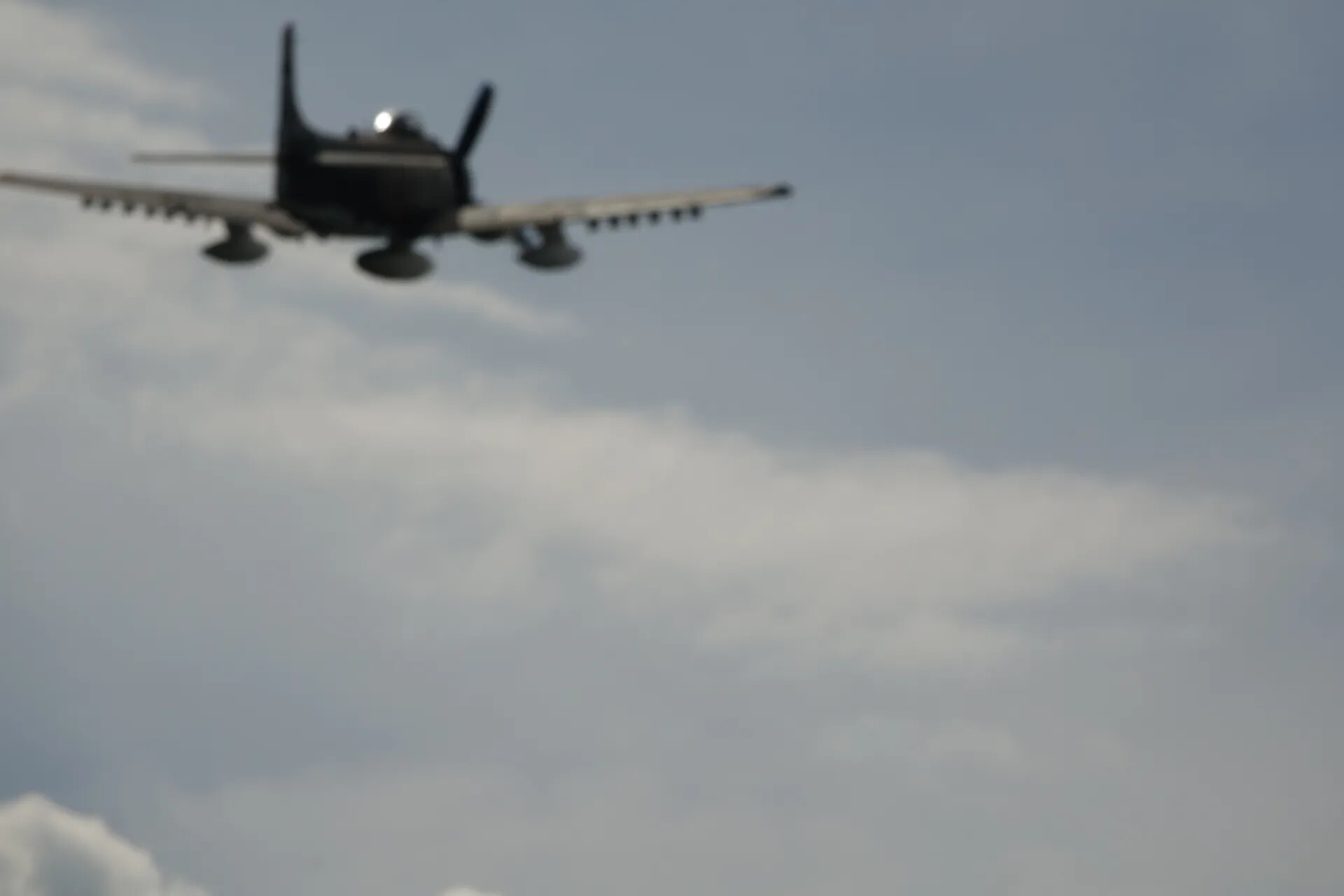 Douglas A-1 Skyraider Banking Away, Overcast Sky, May 2019 Event (Motion Blur)
