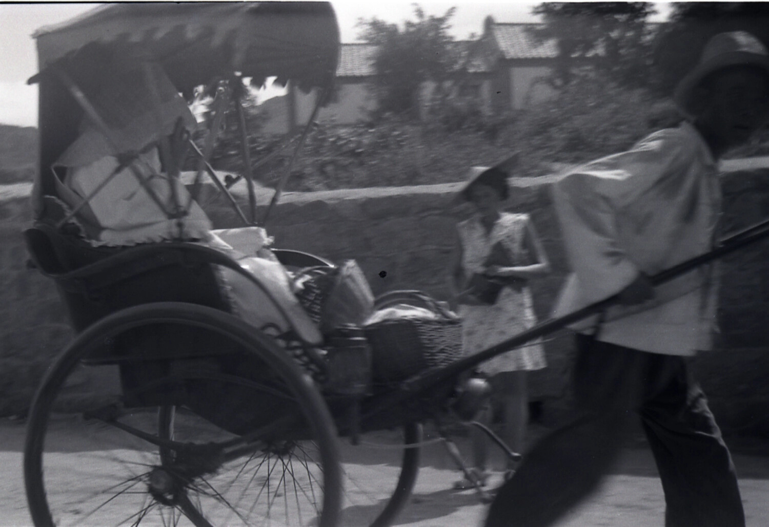 Rickshaw Puller with Loaded Cart and Western Woman on a Chinese Village Street