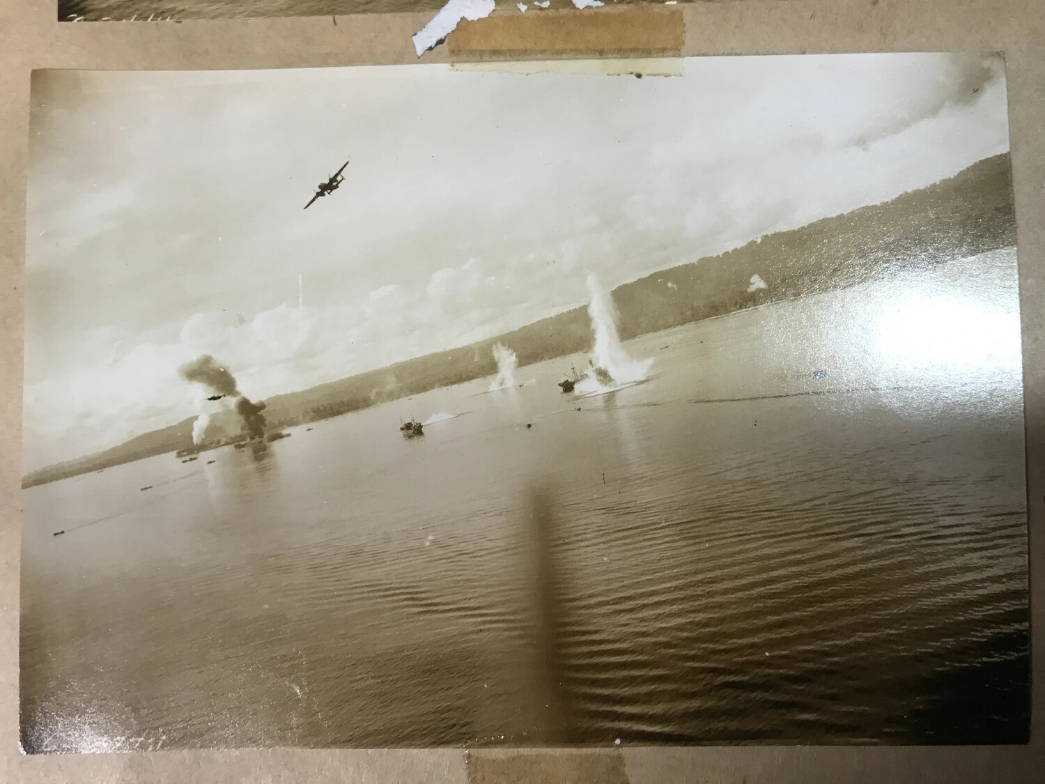 Album-Mounted Photograph: B-25 Mitchells Striking Japanese Shipping in Harbor