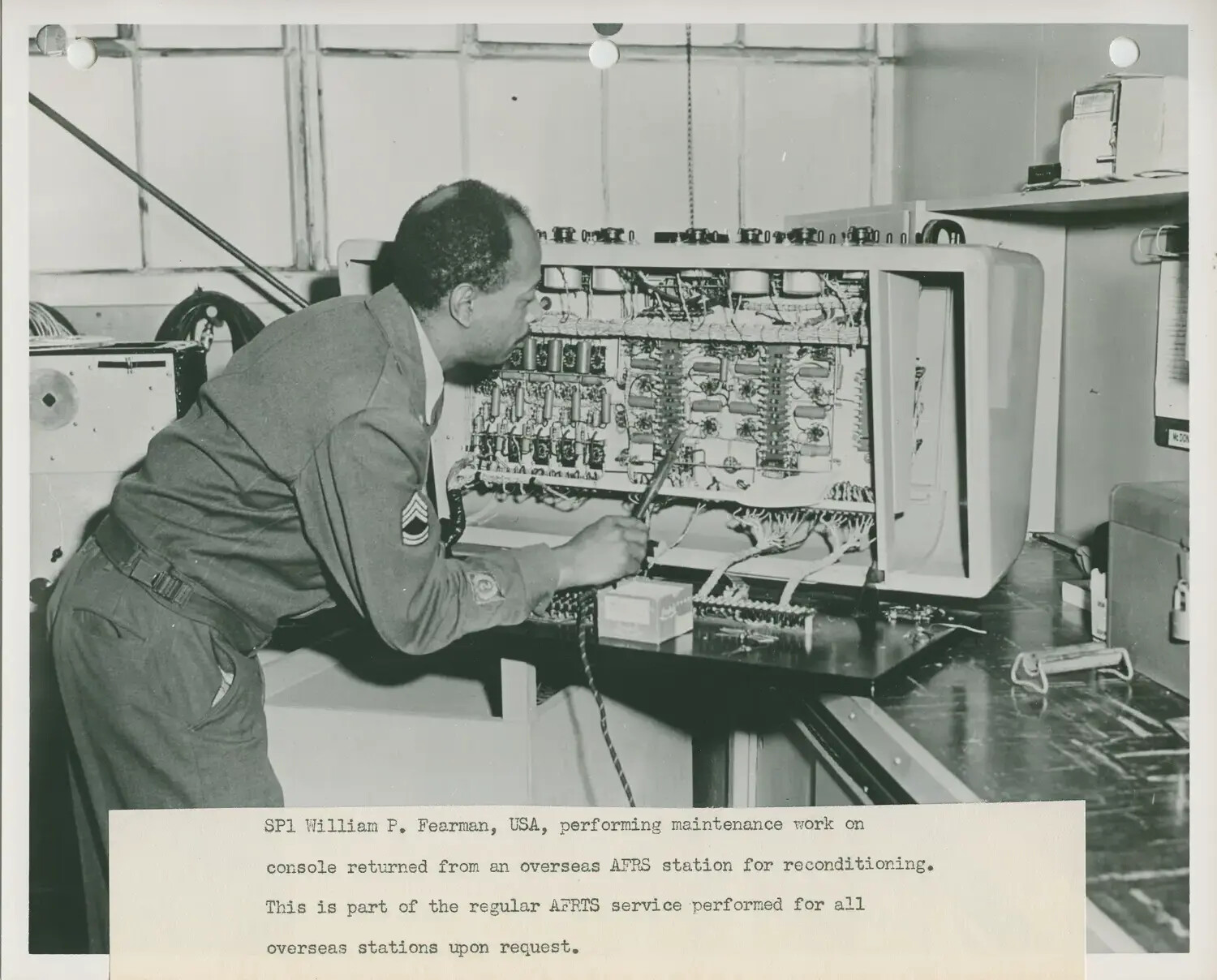 SP1 William P. Fearman Servicing an AFRS Broadcast Console, Armed Forces Radio and Television Service