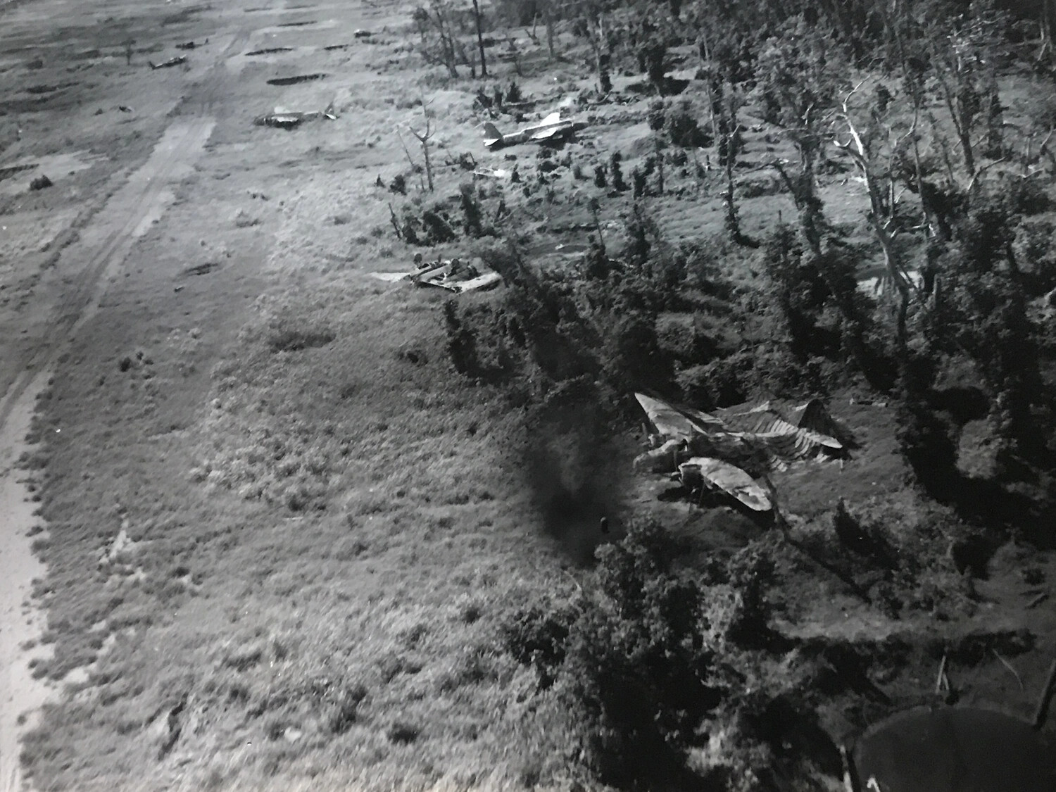 Low-Level Strike Photo: Wewak Airstrip with Bomb Impact and Aircraft Wreckage, New Guinea