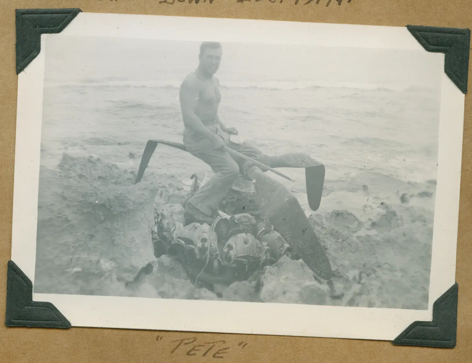Serviceman Atop Crashed Aircraft Engine on Hawaiian Coastline, "Pete"