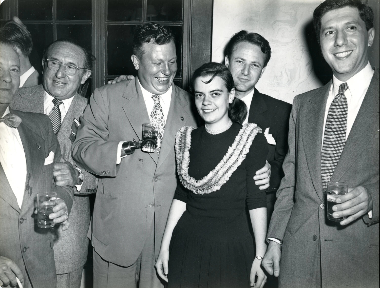 Group Portrait of Six Convention Attendees with Lei-Wearing Young Woman, Late 1940s