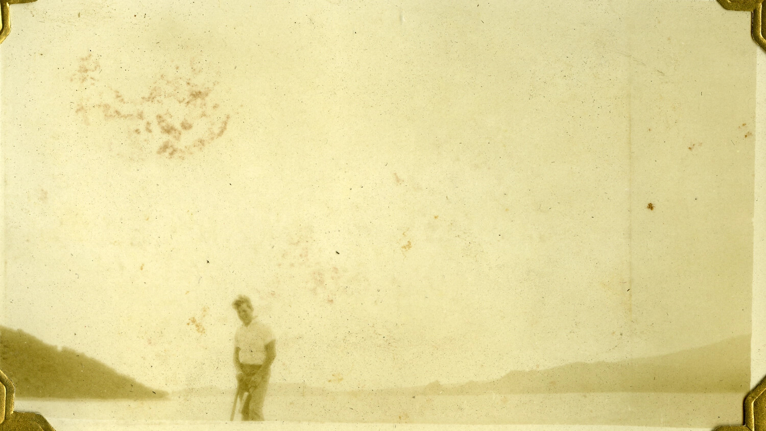 Faded Snapshot of a Man on a Shoreline, Manila Photo Album