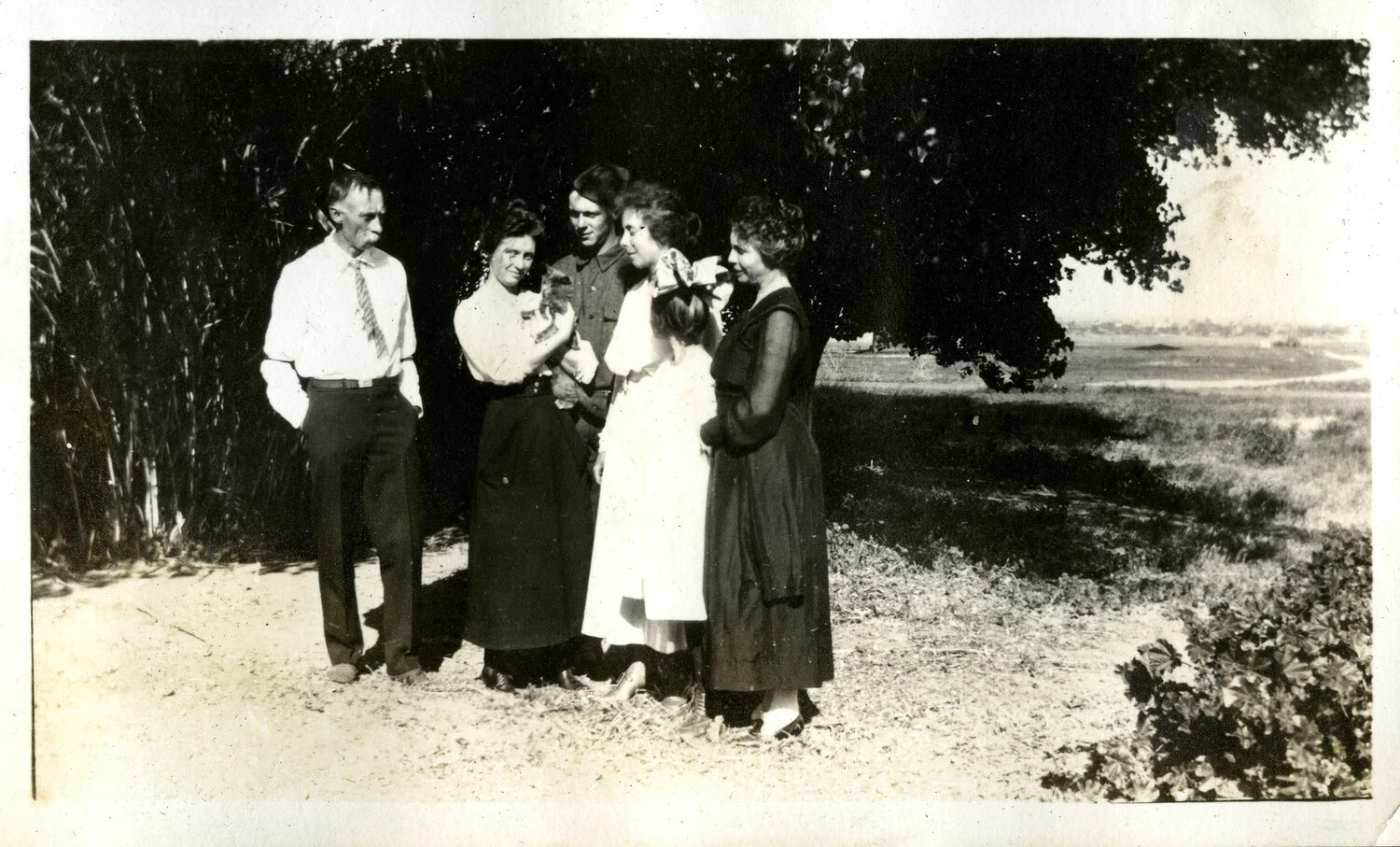 Extended Family Group Portrait with Soldier on Home Leave, WWI Era, Late 1910s