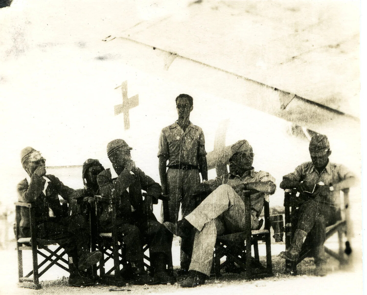 American Servicemen Pose Beneath Green Cross-Marked Envoy Aircraft, Ie Shima, August 1945