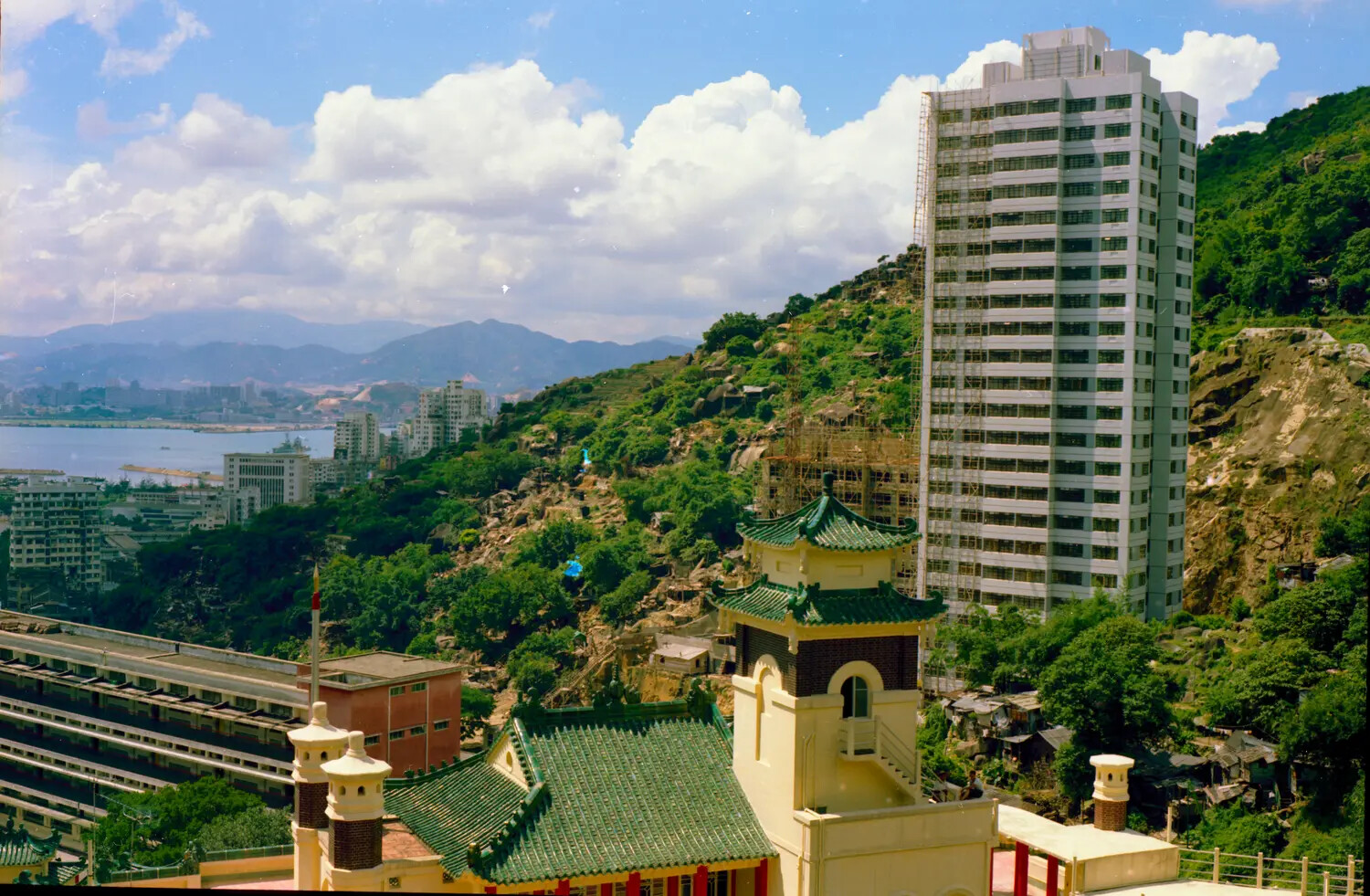 Hillside View with Pagoda-Roofed Building and High-Rise Construction, Hong Kong, Vietnam War Era