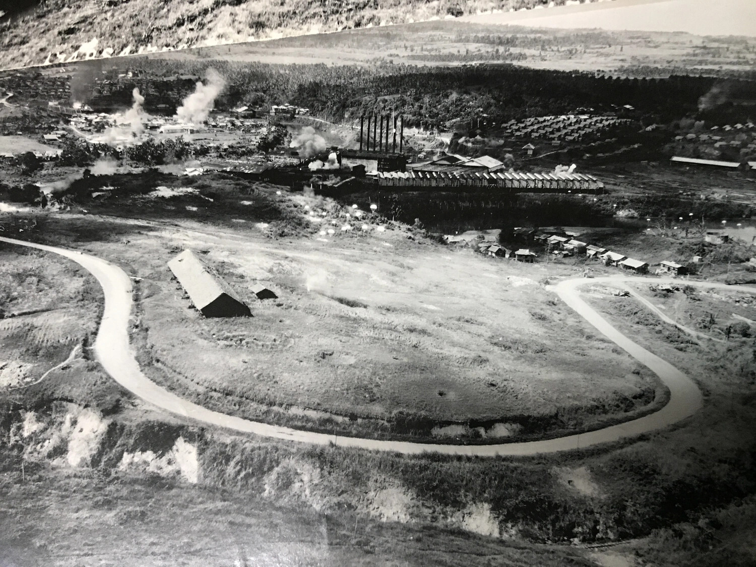 Strike Photograph: Active Bombing of Sugar Mill Complex, Luzon, 312th Bomb Group