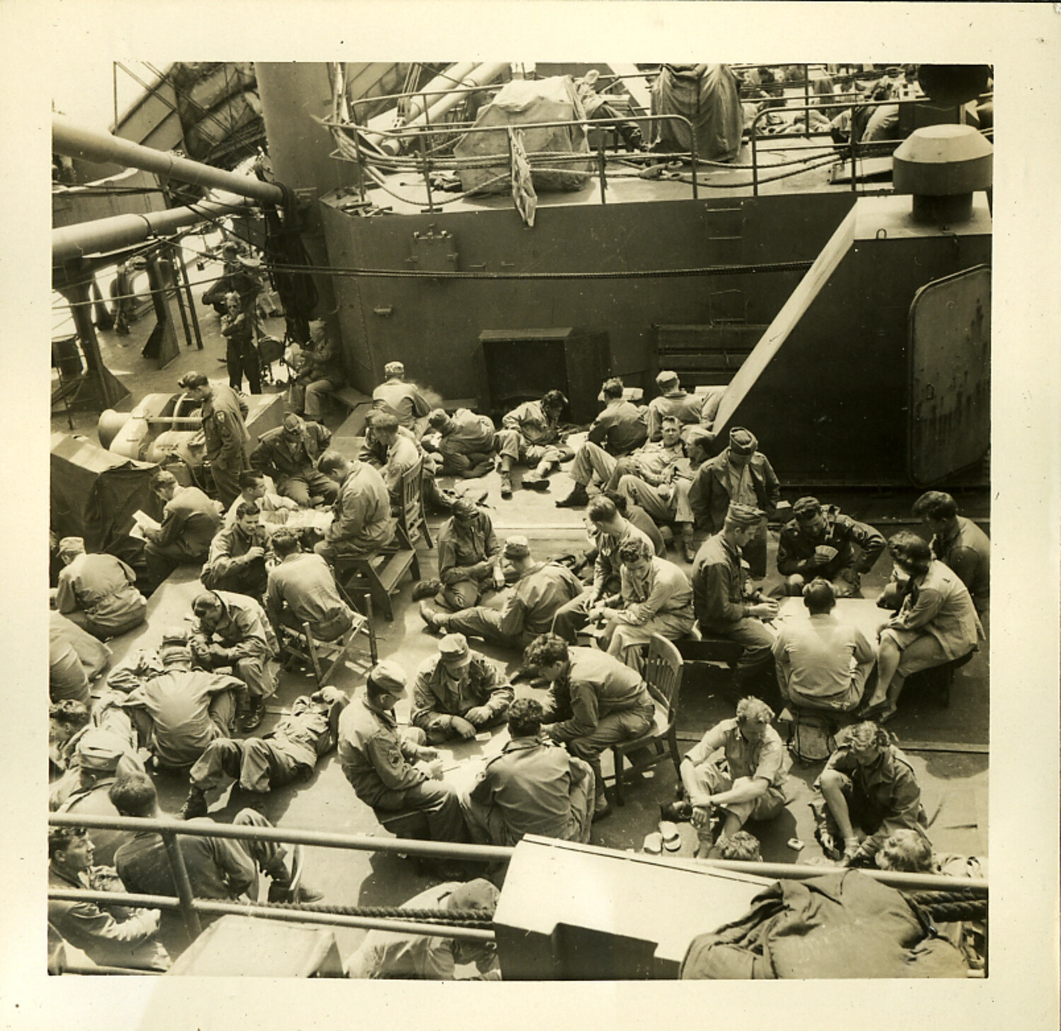 Servicemen Playing Cards and Resting on Crowded Deck, Troop Transport Ship, WWII/Postwar Era