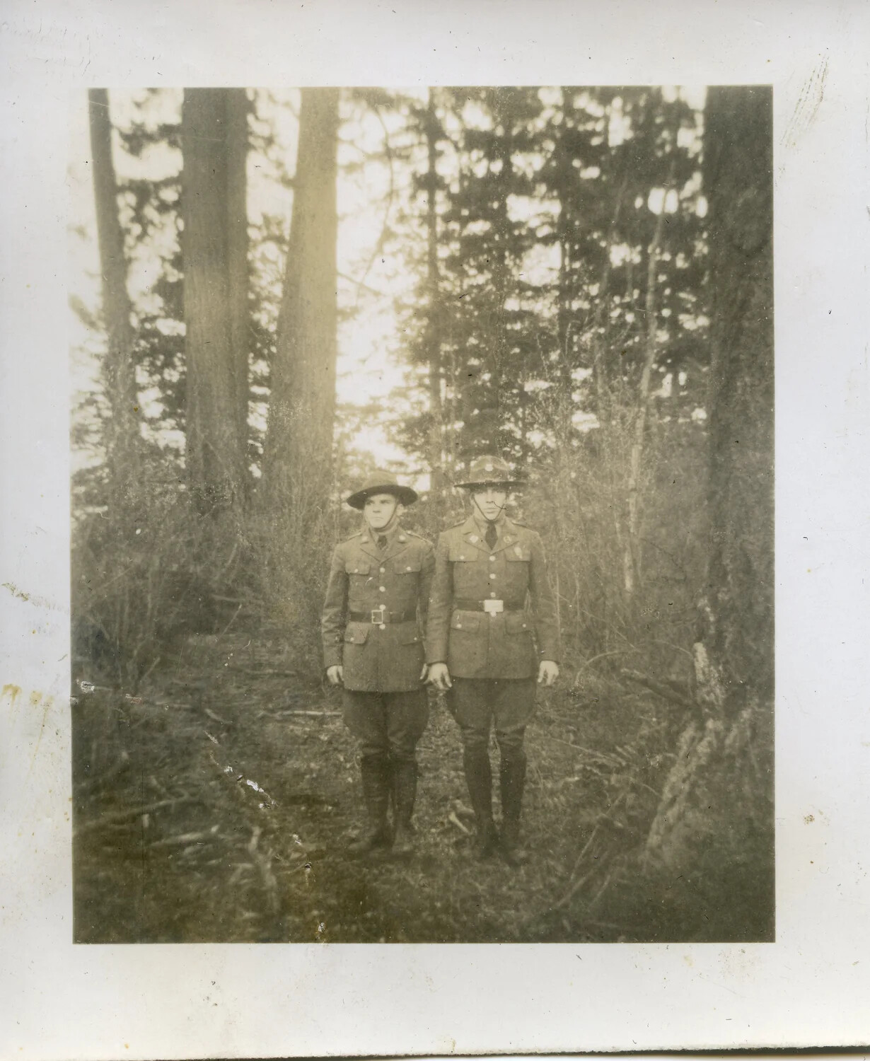 Two U.S. Army Soldiers in Service Uniform, Forest Setting, Early 20th Century (WWI/Interwar Era)