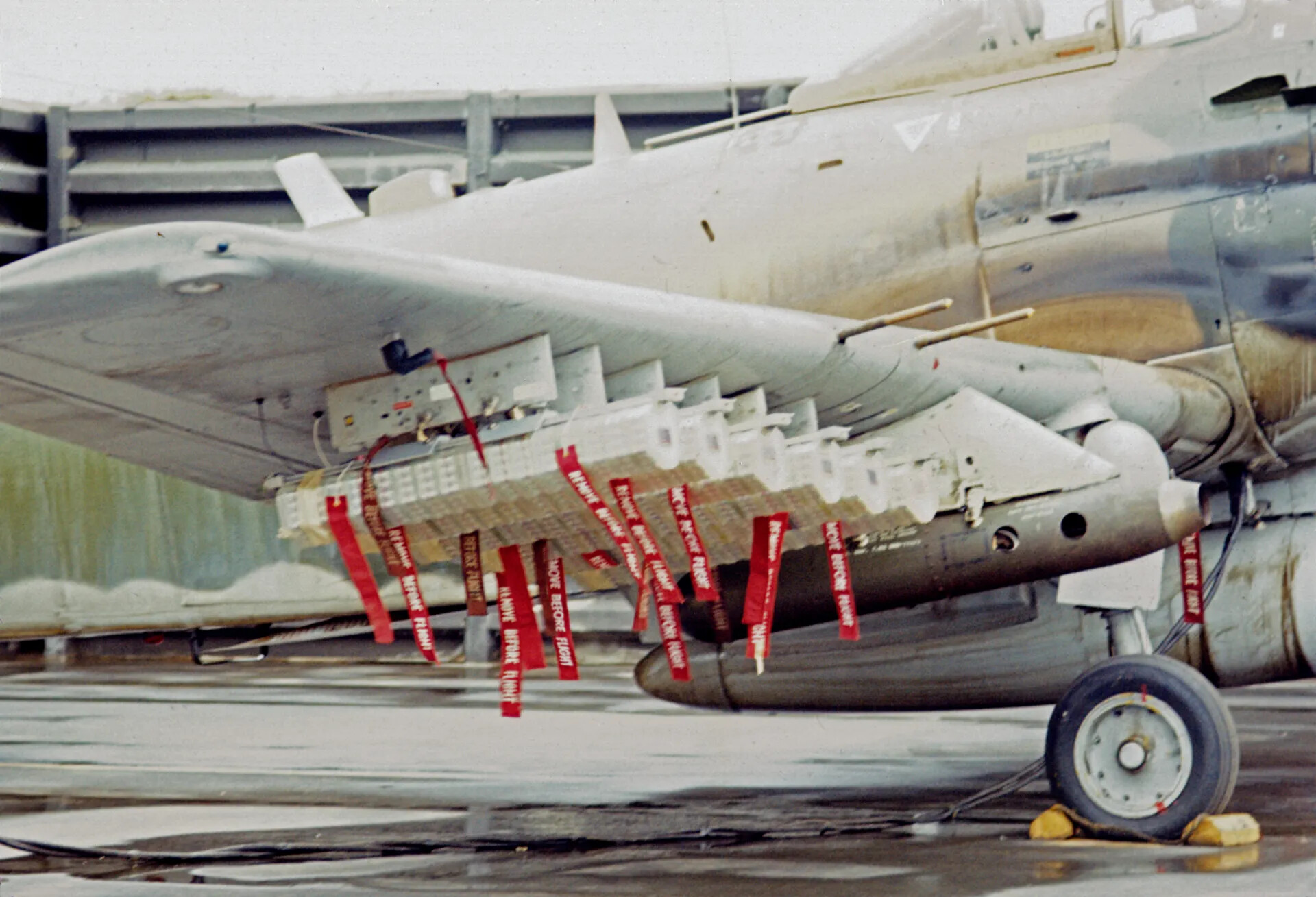 Loaded Underwing Weapons Stations of an A-1 Skyraider with 'Remove Before Flight' Streamers, circa March 1970
