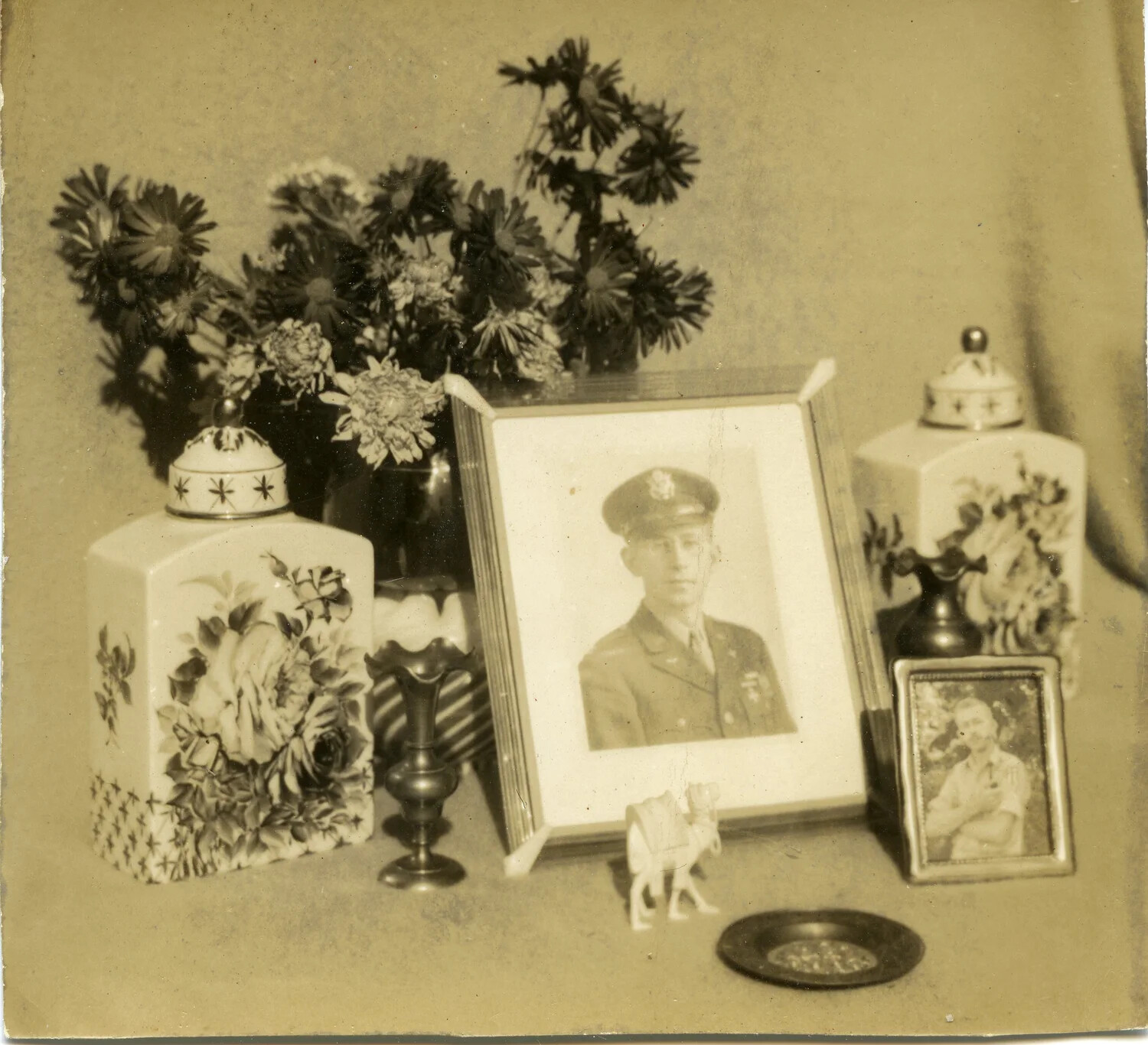 Home Memorial Display with Framed Military Portrait and Personal Mementos, WWII Era
