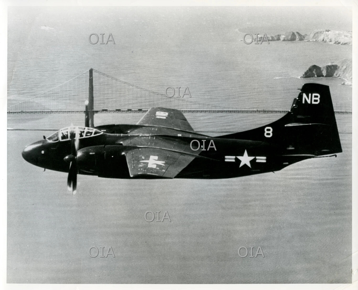 US Navy Twin-Engine Patrol Aircraft in Flight over the Golden Gate Bridge