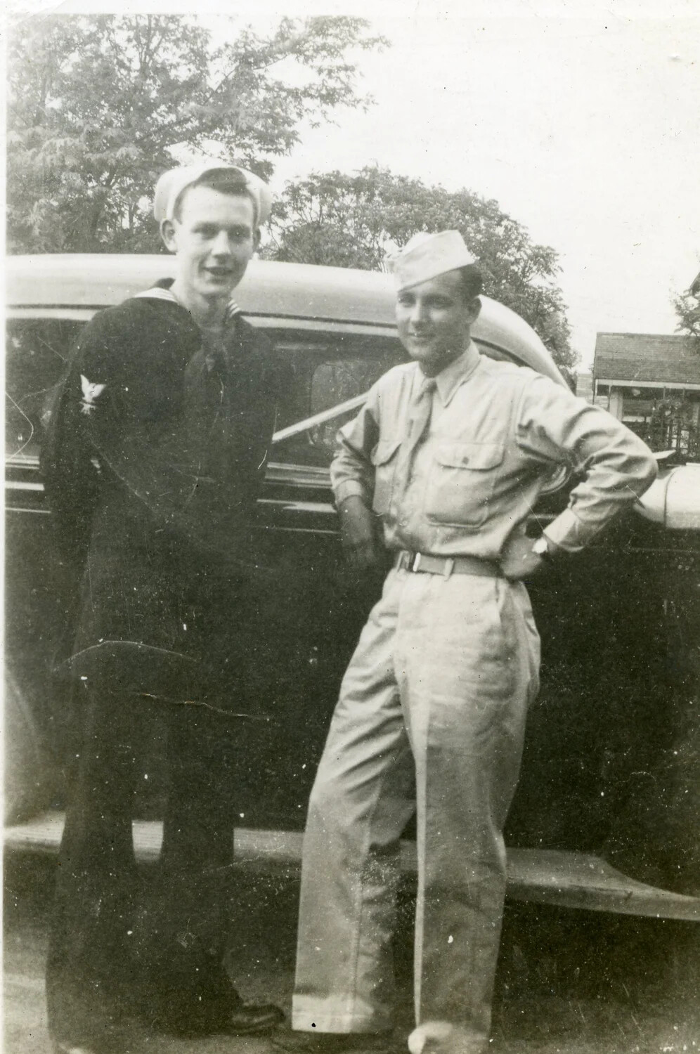 Two Servicemen Posed Beside an Automobile While on Leave, USS Charr (SS-328) Collection