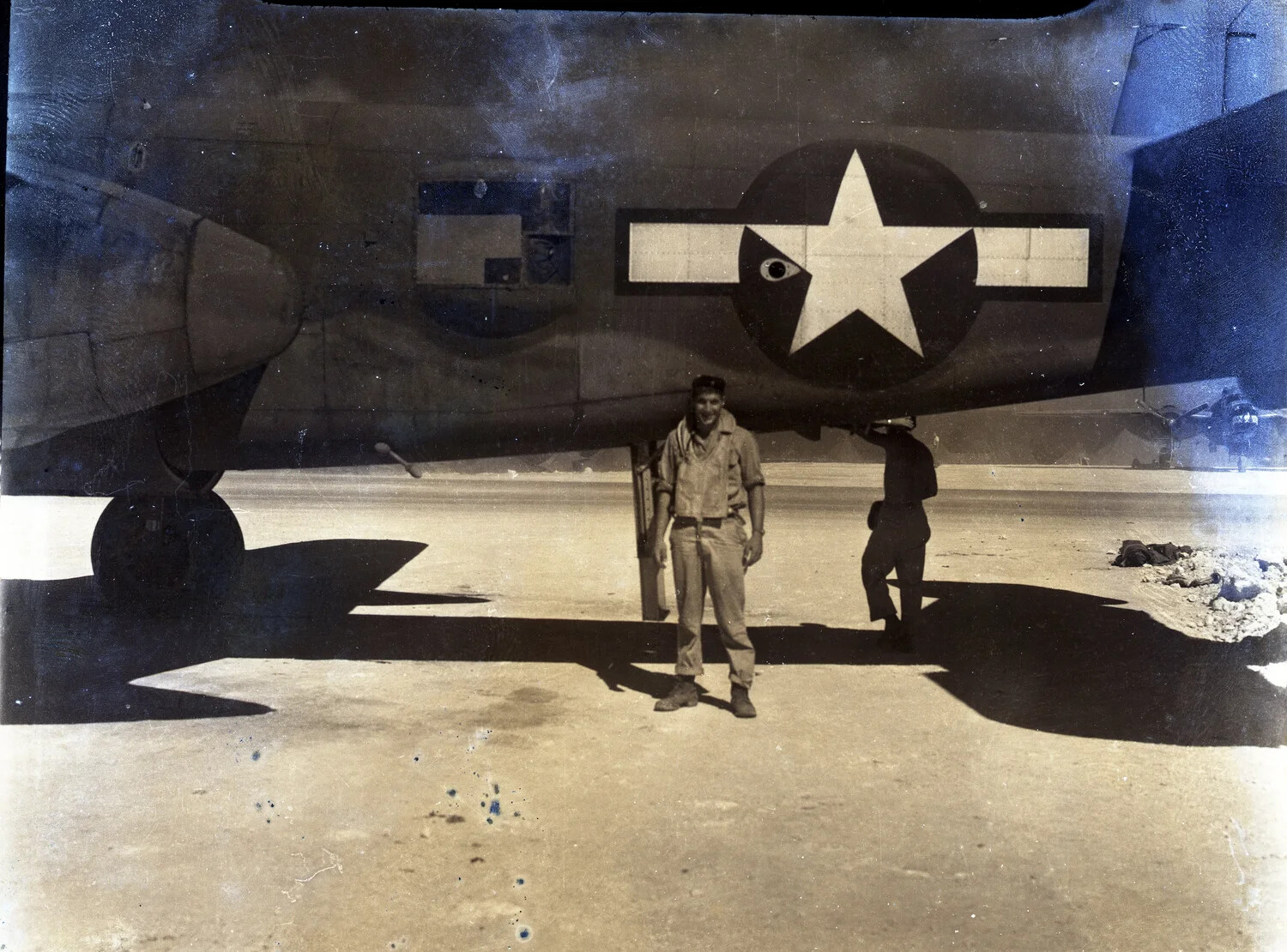 B-25 Mitchell Bomber with Ground Crewman Beneath Port Wing, Ie Shima, 345th Bombardment Group, WWII Pacific Theater