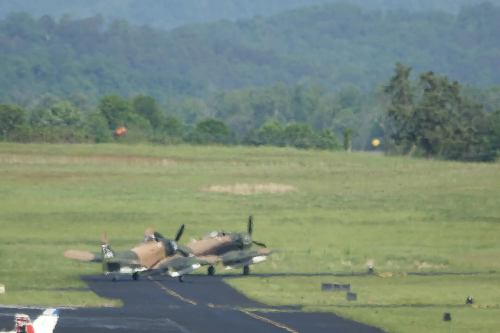 Two A-1 Skyraiders Taxiing in Formation at Airshow Event, May 2019