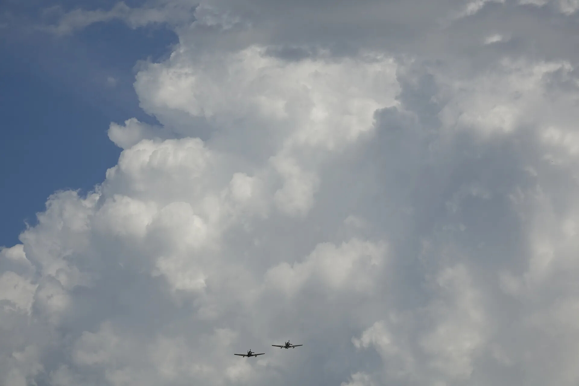 Two Aircraft in Formation Beneath Cumulus Clouds, May 2019 Event