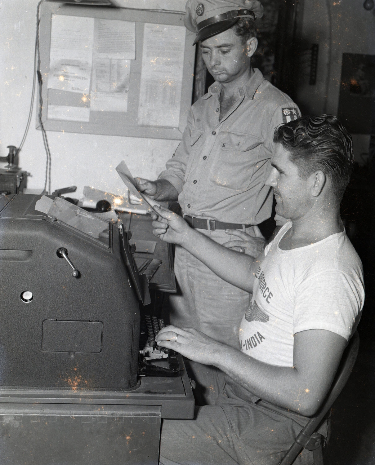 Two Airmen at Office Machine, China-Burma-India (CBI) Theater, WWII
