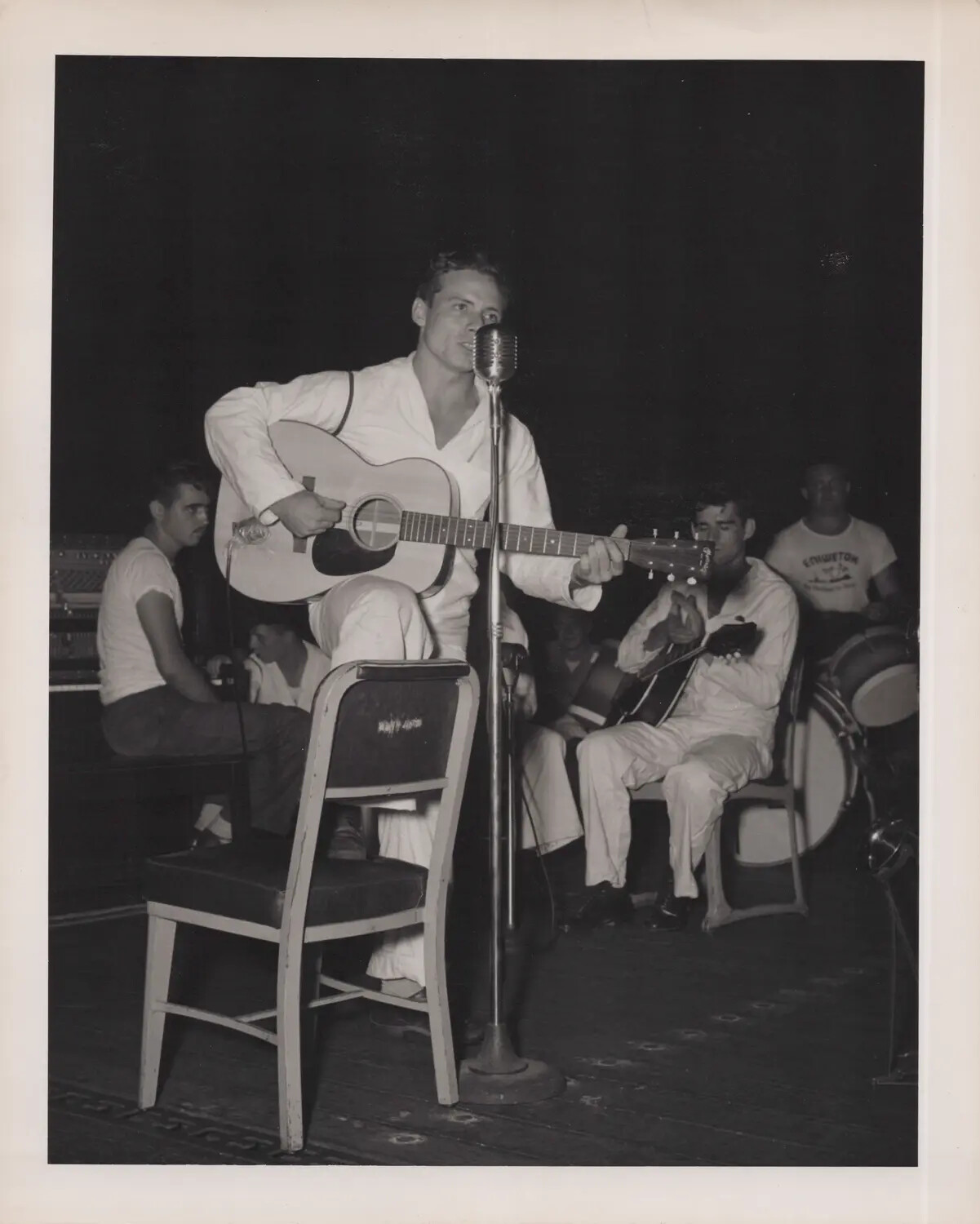 Sailor Guitarist and Vocalist Performing with Band Aboard a U.S. Navy Escort Carrier, WWII