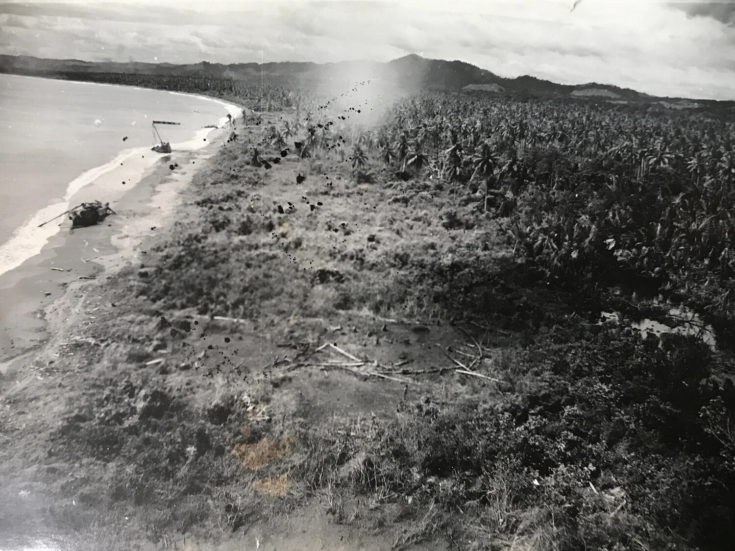 Aerial View of Pacific Invasion Beach with Wrecked Landing Craft, WWII Southwest Pacific Theater