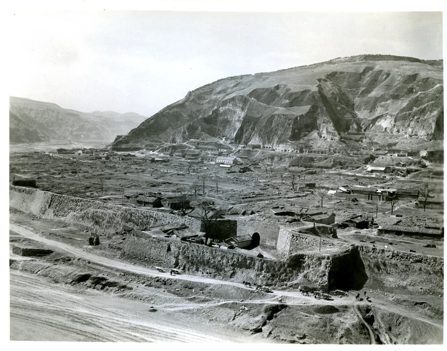 Fortified Town and Loess Hillside with Cave Dwellings, China, WWII Era