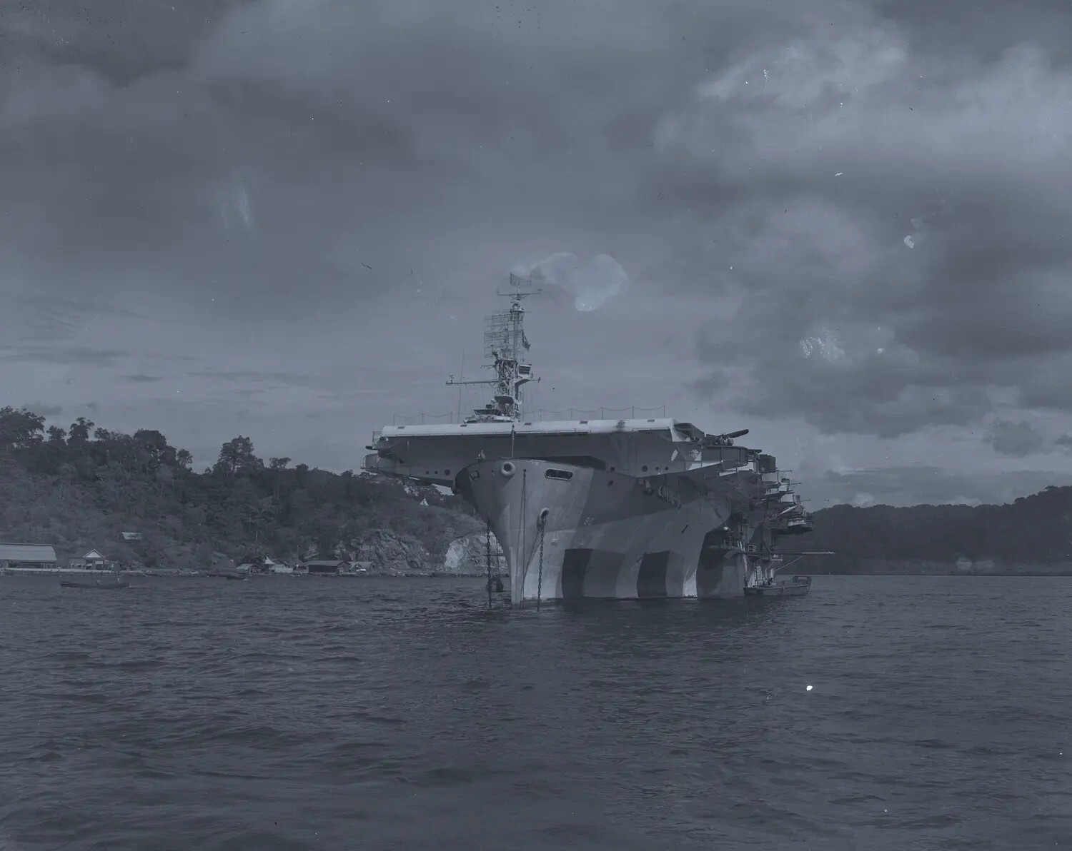 Bow View of USS Petrof Bay (CVE-80) at Anchor in Tropical Pacific Harbor, WWII Era