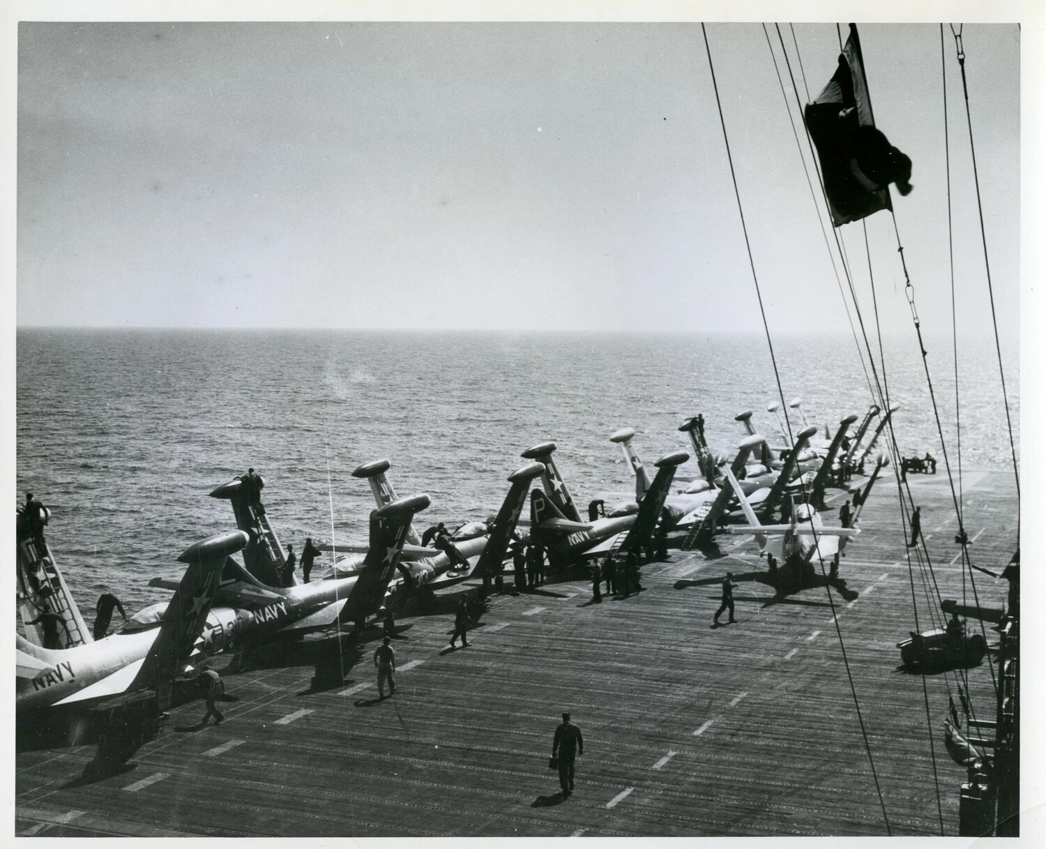 U.S. Navy Jet Fighters Parked Along Carrier Flight Deck Edge, Korean War Era