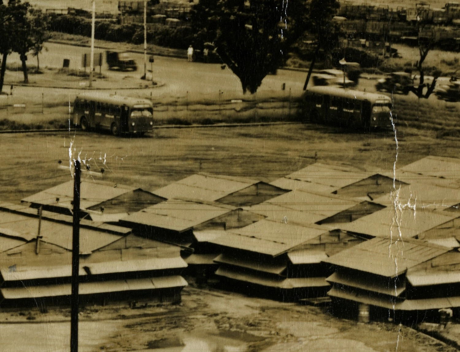 Detail View: Buses at Roadway Junction Near Shed Rows, Battery 'C' Encampment, Manila, Philippines, 1946