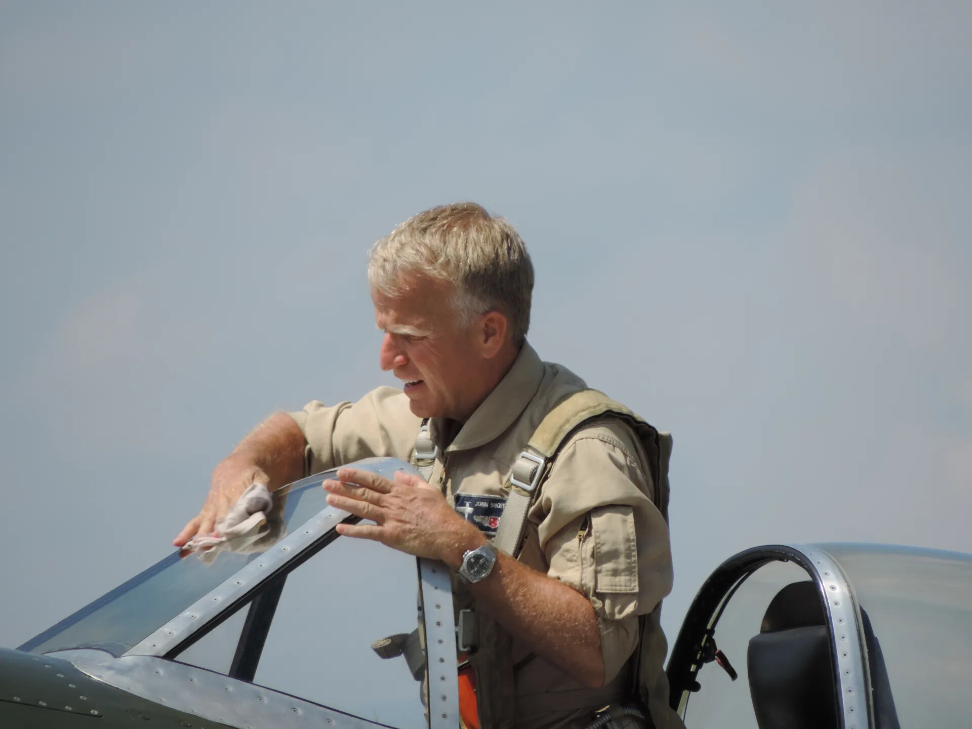 Warbird Pilot Wiping Down Canopy, Tennessee Air Museum Air Show, June 2014