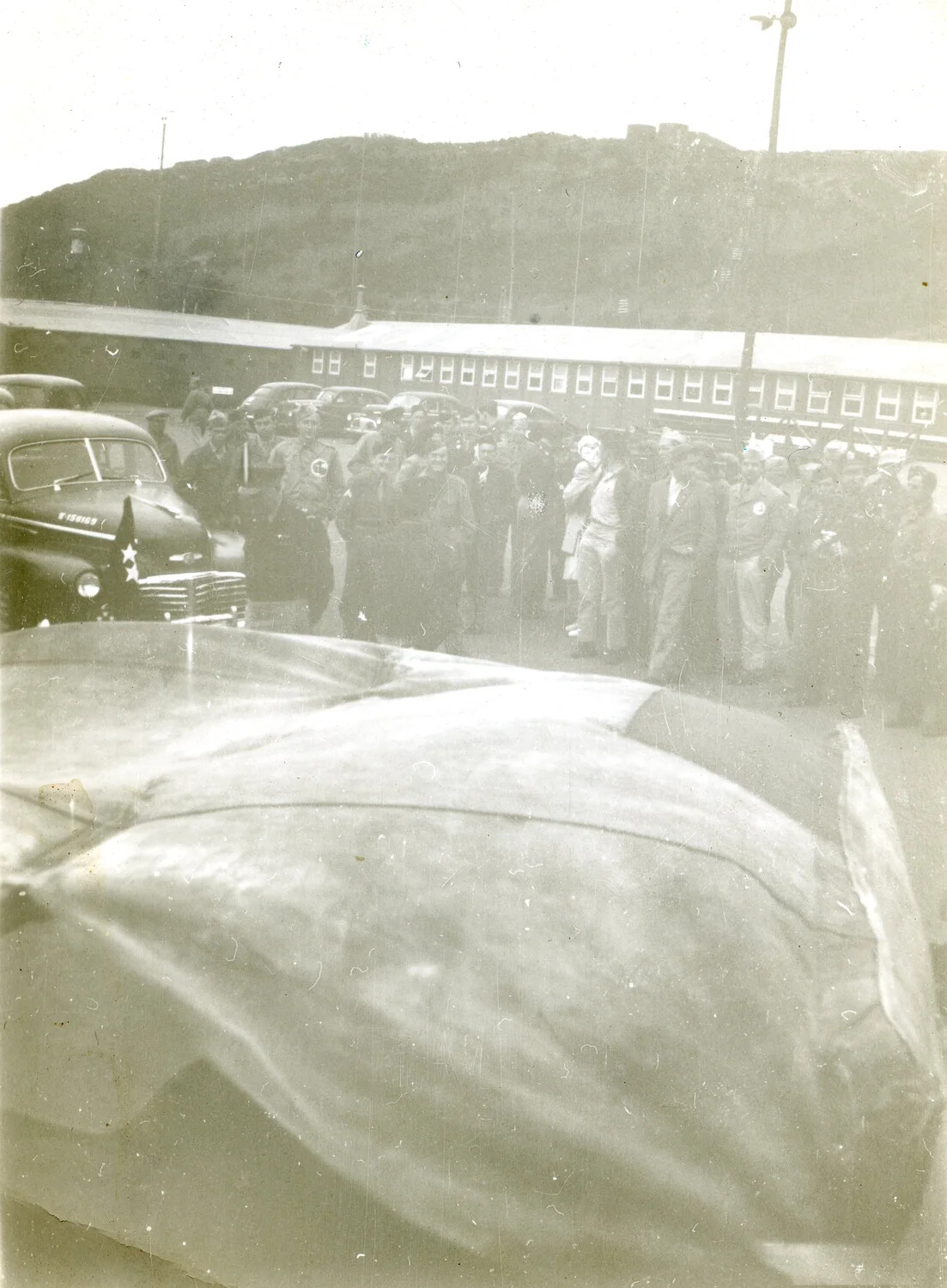 Crowd of Servicemen Awaiting Arrival Near Staff Cars and Rail Car, Kessler/Eisenhower Collection, 1946
