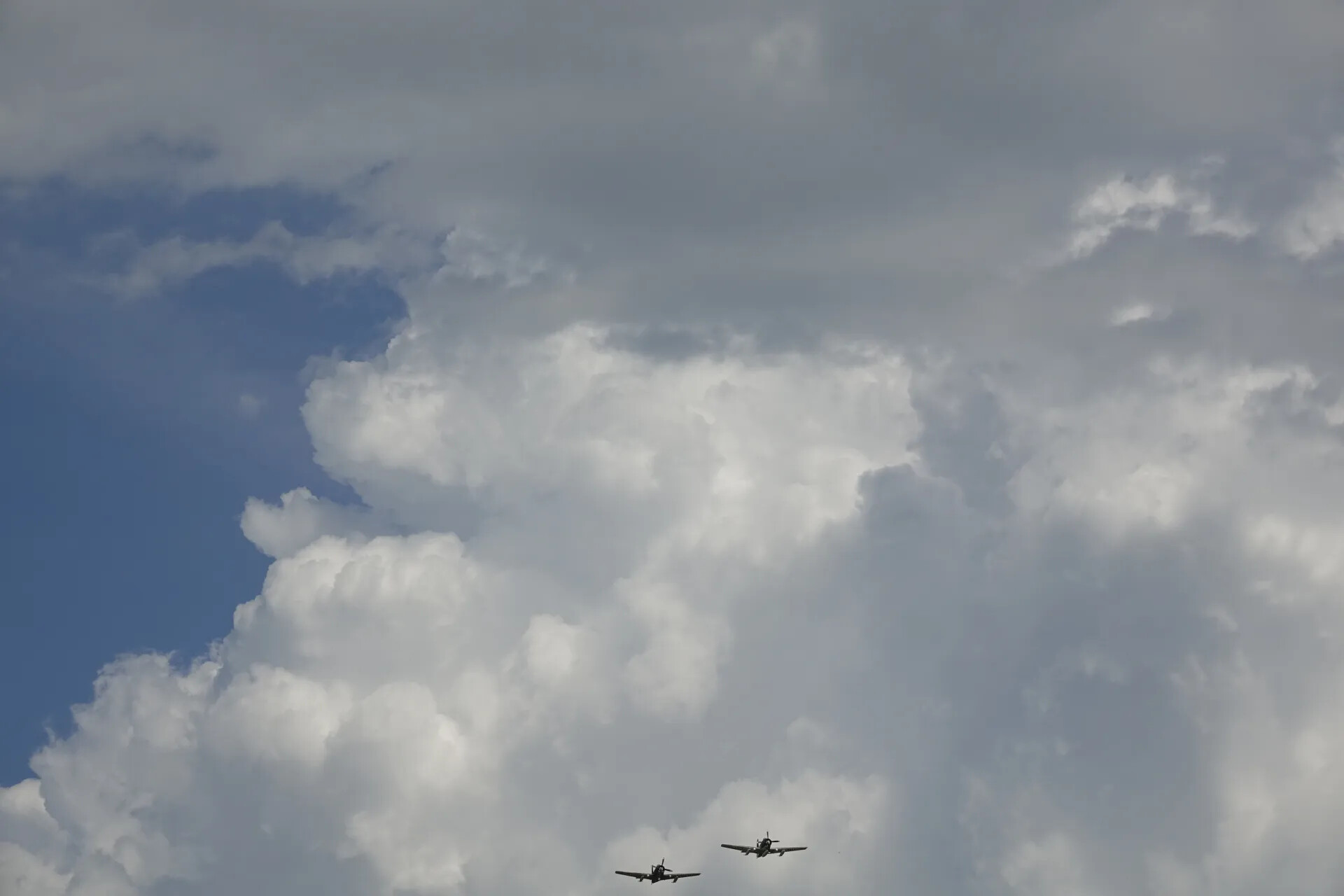 Formation Pass Beneath Cumulus Cloud Bank, Wide View